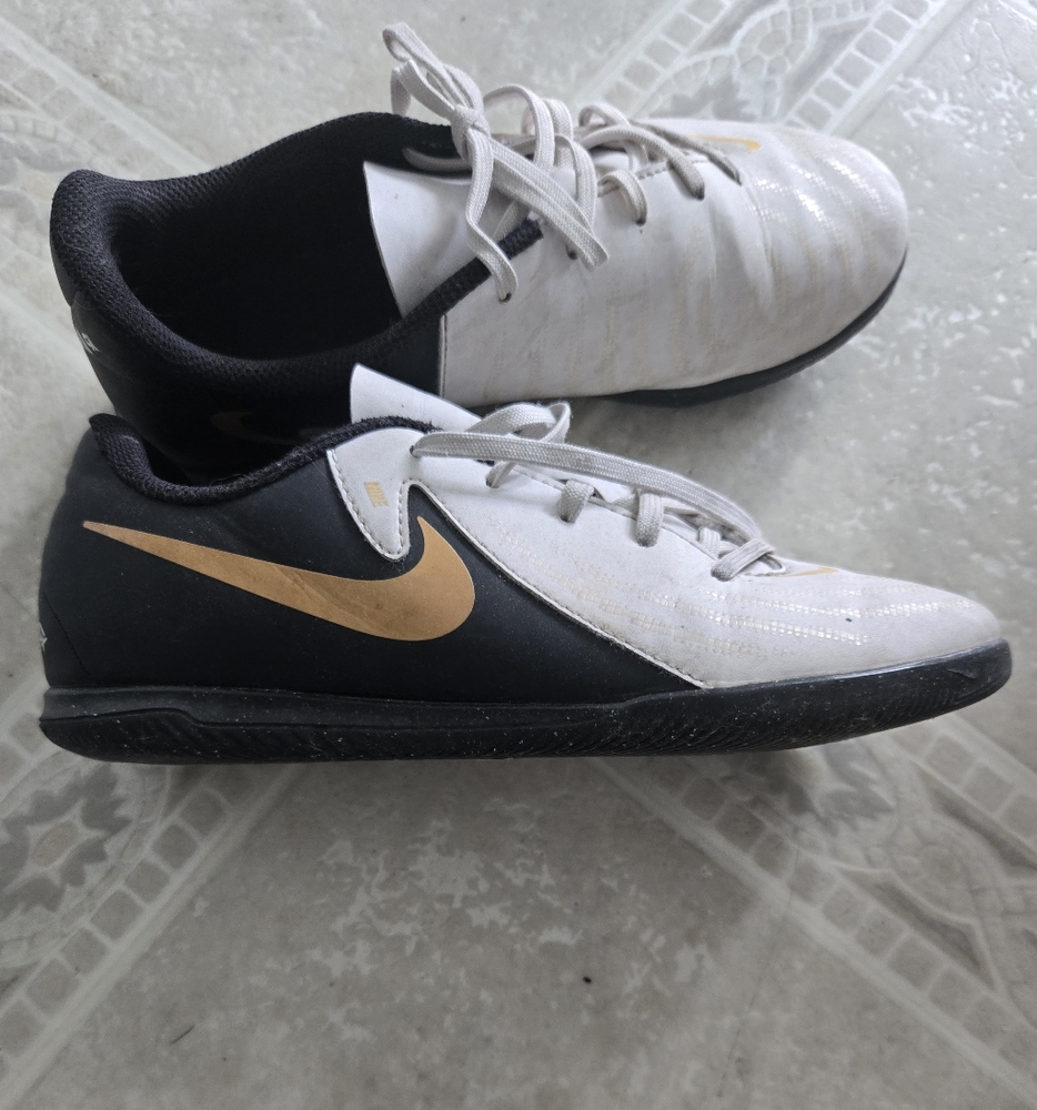 Nike Black and White Shoes with Gold Logo
